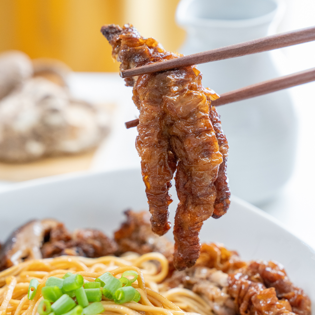 Close up of the braised chicken feet and shiitake side dish